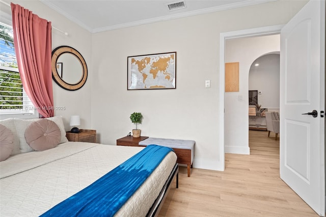 1636 Arthur St, Hollywood, FL 33020 - bedroom with arched walkways, light wood-type flooring, crown molding, and baseboards