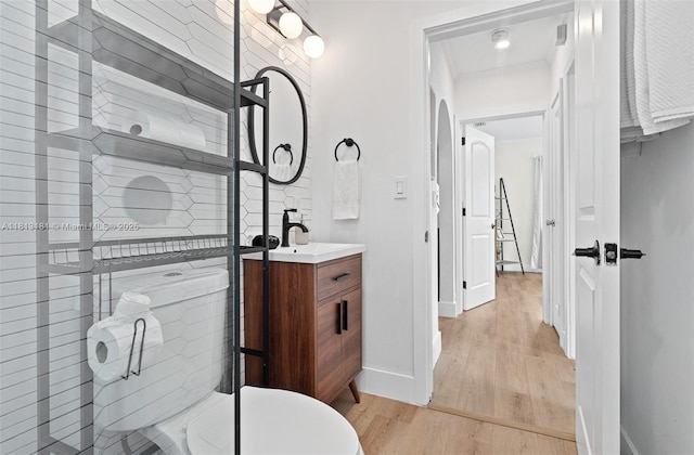 1636 Arthur St, Hollywood, FL 33020 - bathroom with wood finished floors, vanity, baseboards, and a tub