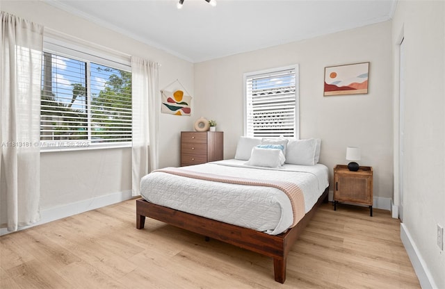 1636 Arthur St, Hollywood, FL 33020 - bedroom with wood finished floors, crown molding, and baseboards
