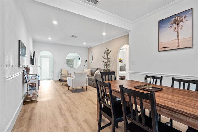 1636 Arthur St, Hollywood, FL 33020 - dining area with arched walkways, light wood-type flooring, ornamental molding, recessed lighting, and baseboards