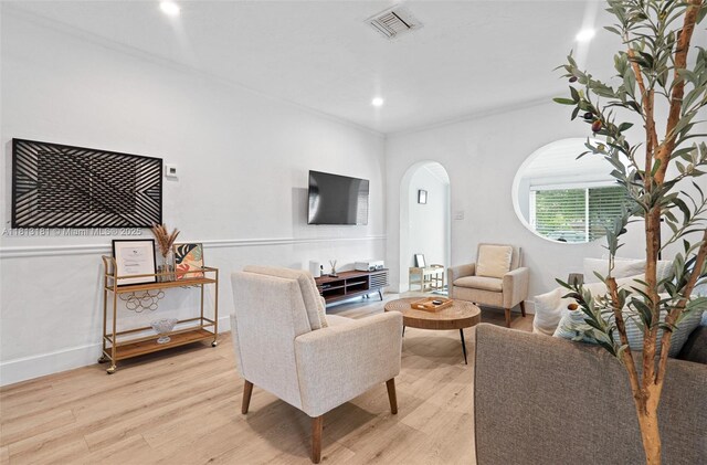1636 Arthur St, Hollywood, FL 33020 - living area with arched walkways, light wood-style flooring, recessed lighting, and baseboards