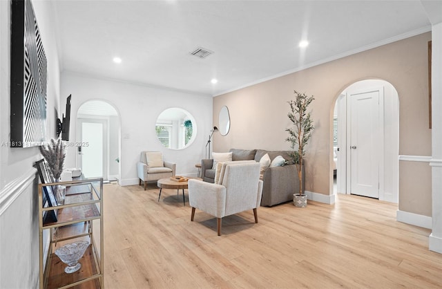 1636 Arthur St, Hollywood, FL 33020 - living area featuring arched walkways, light wood-type flooring, crown molding, recessed lighting, and baseboards
