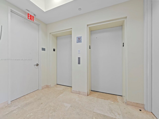 15901 Collins Ave Unit 403, Sunny Isles Beach, FL 33160 - hallway with elevator and baseboards