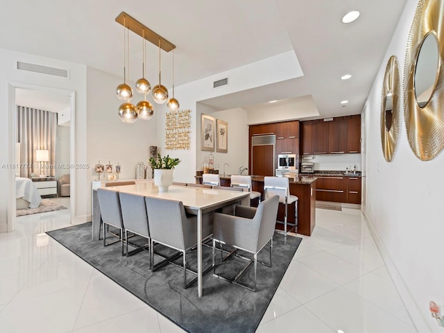 15901 Collins Ave Unit 403, Sunny Isles Beach, FL 33160 - dining room featuring baseboards, recessed lighting, and light tile patterned floors