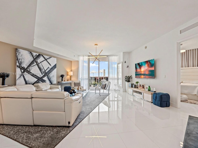 15901 Collins Ave Unit 403, Sunny Isles Beach, FL 33160 - tiled living area featuring a wall of windows