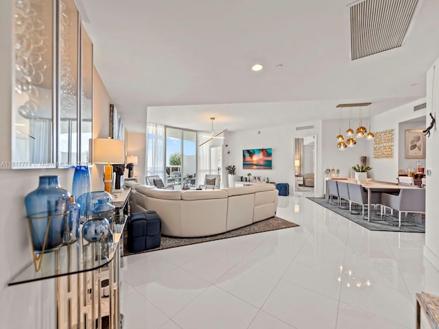 15901 Collins Ave Unit 403, Sunny Isles Beach, FL 33160 - tiled living area featuring a chandelier and recessed lighting