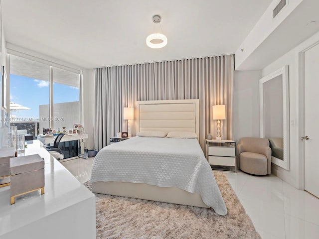 15901 Collins Ave Unit 403, Sunny Isles Beach, FL 33160 - bedroom featuring tile patterned floors and expansive windows