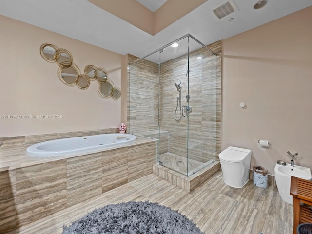 15901 Collins Ave Unit 403, Sunny Isles Beach, FL 33160 - bathroom with a stall shower, a bath, a bidet, and toilet