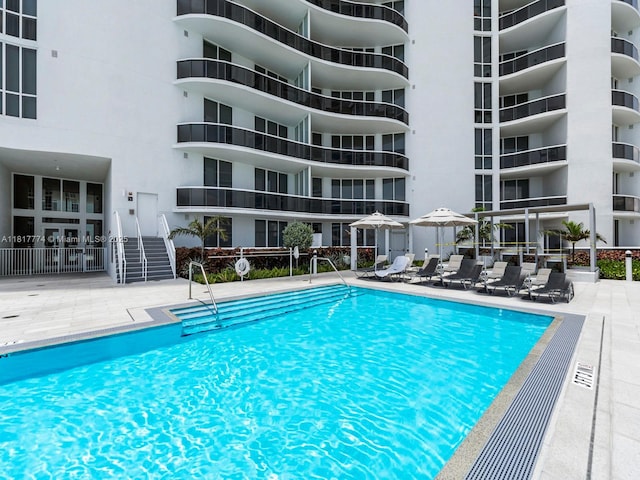15901 Collins Ave Unit 403, Sunny Isles Beach, FL 33160 - community pool featuring a patio area