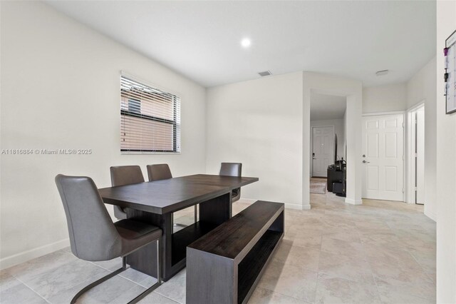 232 SE 33rd Ter, Homestead, FL 33033 - dining area featuring baseboards and light tile patterned flooring
