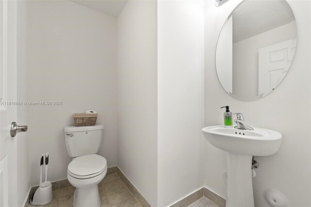 232 SE 33rd Ter, Homestead, FL 33033 - bathroom with toilet and baseboards