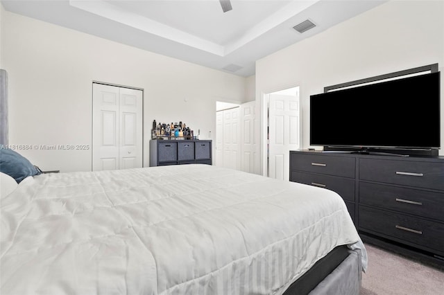 232 SE 33rd Ter, Homestead, FL 33033 - bedroom with two closets, carpet floors, a tray ceiling, and ceiling fan