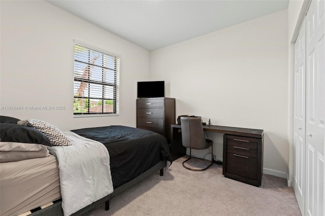 232 SE 33rd Ter, Homestead, FL 33033 - bedroom featuring a closet, light colored carpet, and baseboards