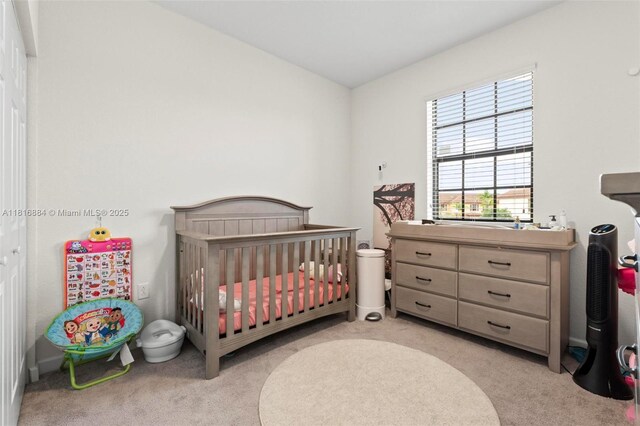 232 SE 33rd Ter, Homestead, FL 33033 - bedroom featuring light colored carpet and a crib