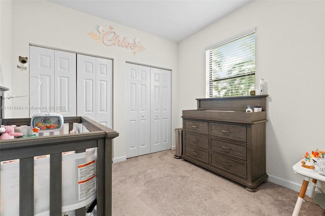 232 SE 33rd Ter, Homestead, FL 33033 - bedroom with light colored carpet, multiple closets, and baseboards