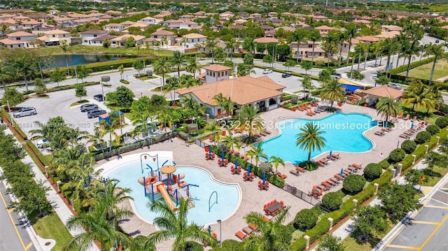 232 SE 33rd Ter, Homestead, FL 33033 - aerial perspective of suburban area featuring a pool and a large body of water