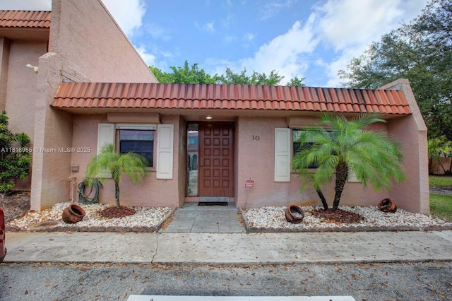 10 Seville Cir Unit 6-54, Davie, FL 33324 - property entrance with a tiled roof and stucco siding