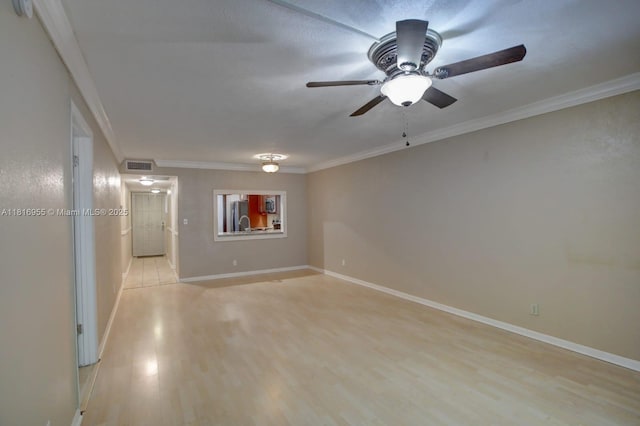 10 Seville Cir Unit 6-54, Davie, FL 33324 - spare room featuring ornamental molding, ceiling fan, light wood-style floors, baseboards, and a smoke detector