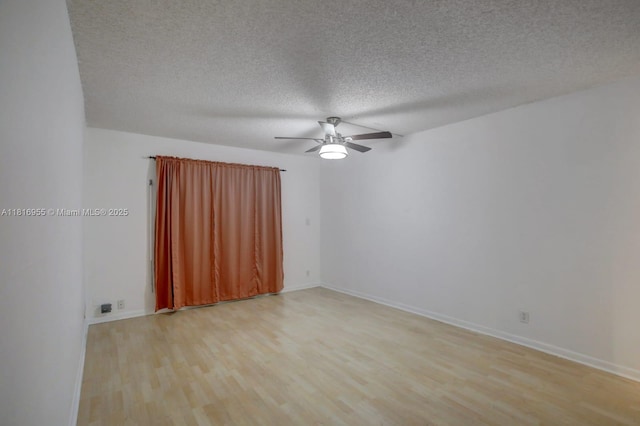 10 Seville Cir Unit 6-54, Davie, FL 33324 - unfurnished room with light wood-style flooring, a ceiling fan, a textured ceiling, and baseboards