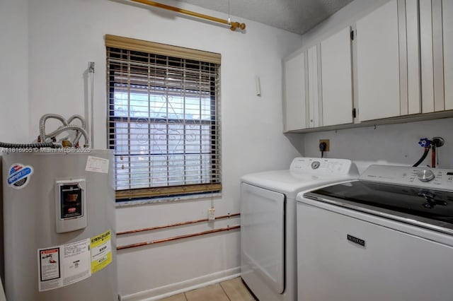 10 Seville Cir Unit 6-54, Davie, FL 33324 - laundry room featuring cabinet space, water heater, washer and dryer, and light tile patterned floors