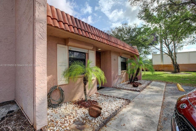 10 Seville Cir Unit 6-54, Davie, FL 33324 - doorway to property with a tiled roof and stucco siding