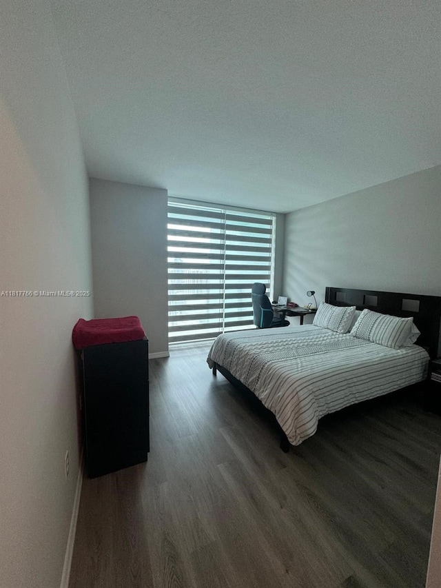 1900 N Bayshore Dr Unit 3909, Miami, FL 33132 - bedroom with wood finished floors, baseboards, and a textured ceiling