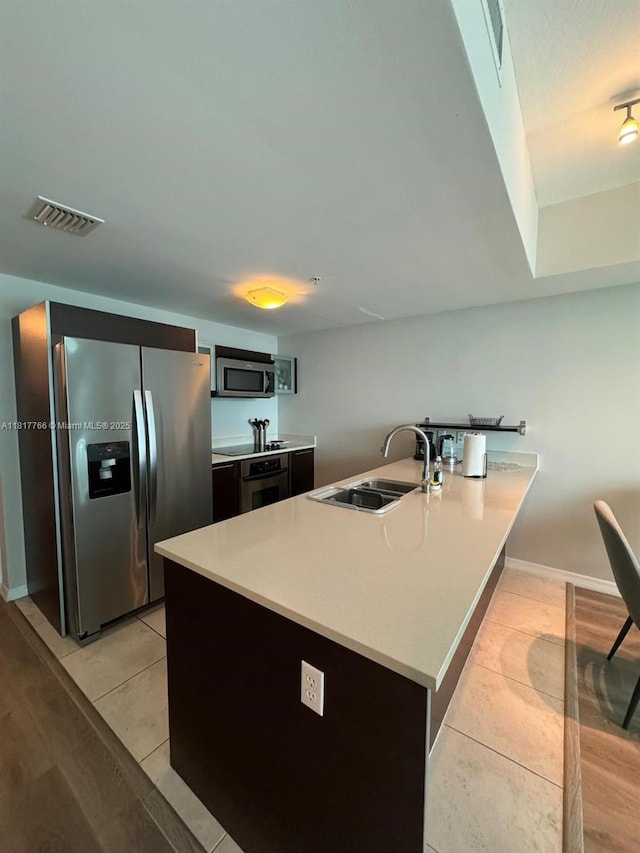 1900 N Bayshore Dr Unit 3909, Miami, FL 33132 - kitchen featuring stainless steel appliances, a sink, light tile patterned flooring, and light countertops