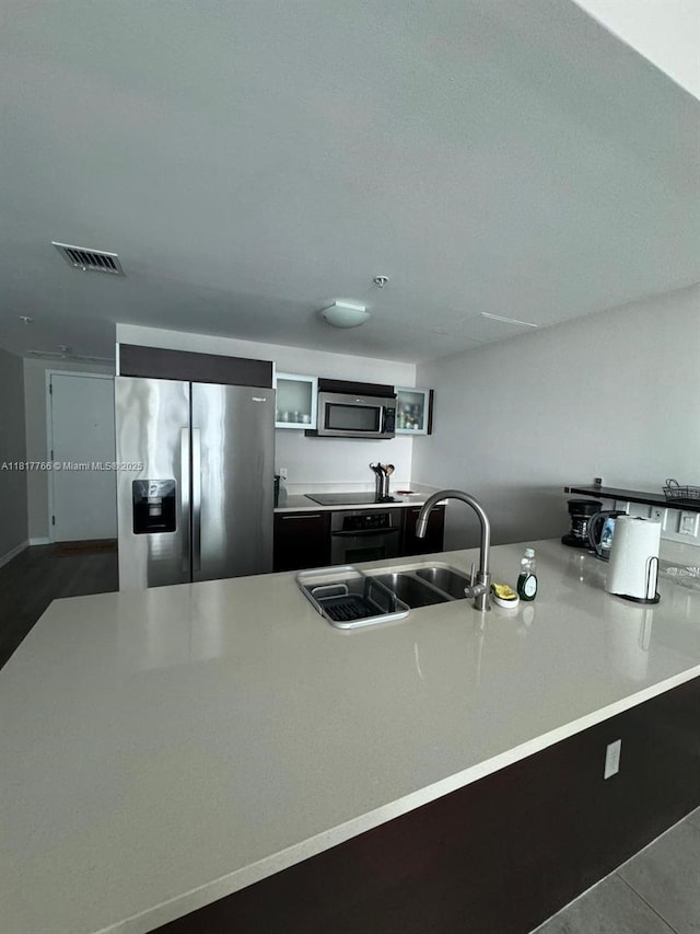 1900 N Bayshore Dr Unit 3909, Miami, FL 33132 - kitchen featuring appliances with stainless steel finishes, a sink, and light countertops