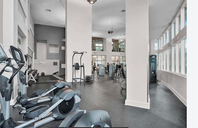1900 N Bayshore Dr Unit 3909, Miami, FL 33132 - gym featuring healthy amount of natural light and a towering ceiling
