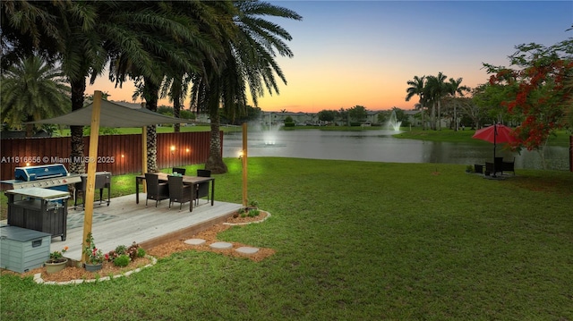 402 SE 30th Ter, Homestead, FL 33033 - yard at dusk featuring a deck with water view