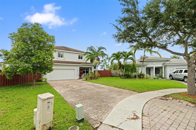 402 SE 30th Ter, Homestead, FL 33033 - view of front of house with decorative driveway, a garage, and stucco siding