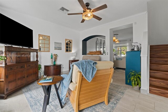 402 SE 30th Ter, Homestead, FL 33033 - living room with a ceiling fan, light tile patterned floors, crown molding, and baseboards