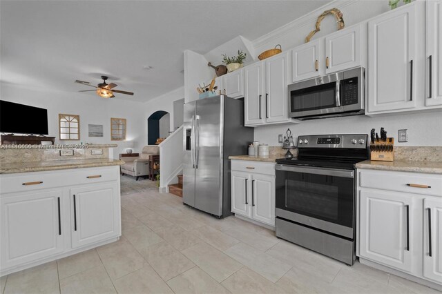 402 SE 30th Ter, Homestead, FL 33033 - kitchen featuring appliances with stainless steel finishes, a ceiling fan, white cabinets, and crown molding