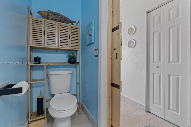 402 SE 30th Ter, Homestead, FL 33033 - bathroom featuring a closet, toilet, tile patterned floors, and baseboards