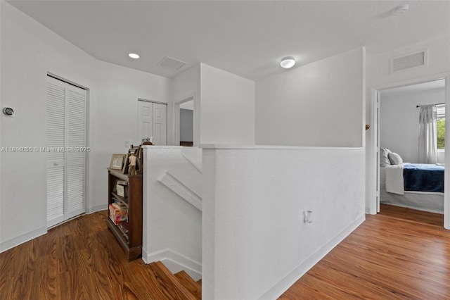 402 SE 30th Ter, Homestead, FL 33033 - hallway featuring an upstairs landing and wood finished floors
