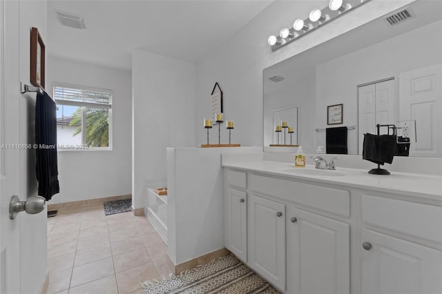 402 SE 30th Ter, Homestead, FL 33033 - bathroom featuring vanity, a bath, tile patterned flooring, and baseboards