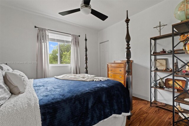 402 SE 30th Ter, Homestead, FL 33033 - bedroom with wood finished floors, a ceiling fan, and baseboards