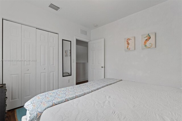 402 SE 30th Ter, Homestead, FL 33033 - bedroom featuring a closet and dark wood finished floors