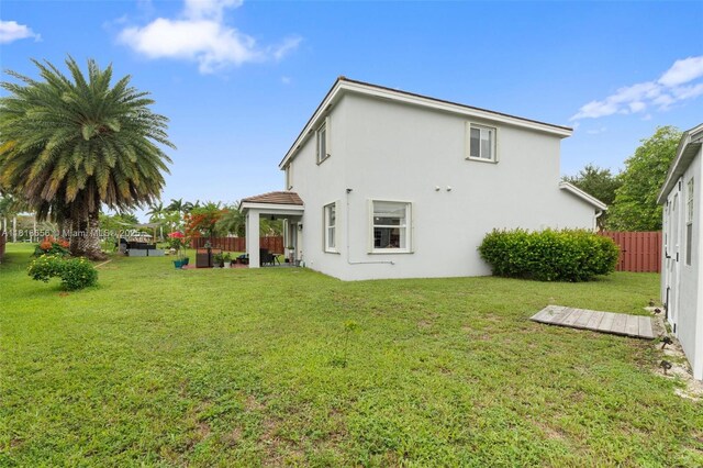 402 SE 30th Ter, Homestead, FL 33033 - back of property featuring stucco siding