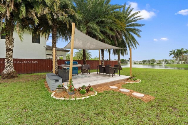 402 SE 30th Ter, Homestead, FL 33033 - view of yard featuring a deck with water view