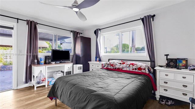 3145 Hollywood Blvd, Hollywood, FL 33021 - bedroom with light wood-style floors, access to outside, and a ceiling fan