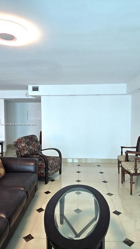 18051 Biscayne Blvd Unit 1501, Aventura, FL 33160 - living area with light tile patterned floors