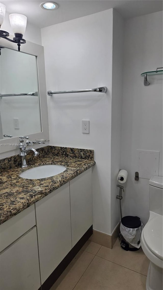 18051 Biscayne Blvd Unit 1501, Aventura, FL 33160 - half bathroom with toilet, vanity, tile patterned floors, and baseboards
