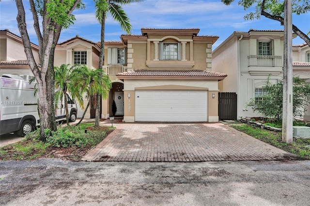 11222 NW 73rd Ter, Doral, FL 33178 - view of front of property featuring stucco siding, decorative driveway, a tile roof, and a garage