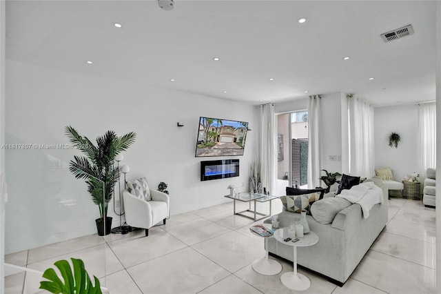 11222 NW 73rd Ter, Doral, FL 33178 - living room featuring a glass covered fireplace, recessed lighting, and light tile patterned flooring