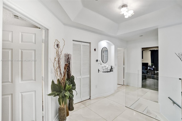 11222 NW 73rd Ter, Doral, FL 33178 - corridor featuring arched walkways, tile patterned flooring, and baseboards