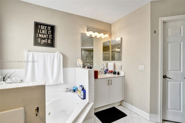 11222 NW 73rd Ter, Doral, FL 33178 - full bathroom with vanity, a tub with jets, tile patterned floors, and baseboards