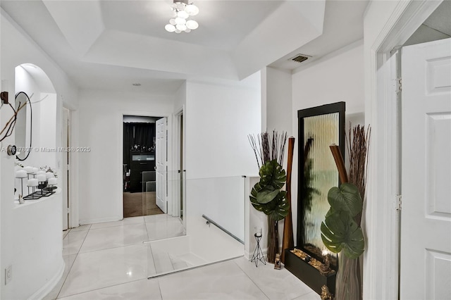 11222 NW 73rd Ter, Doral, FL 33178 - hallway featuring a raised ceiling and baseboards