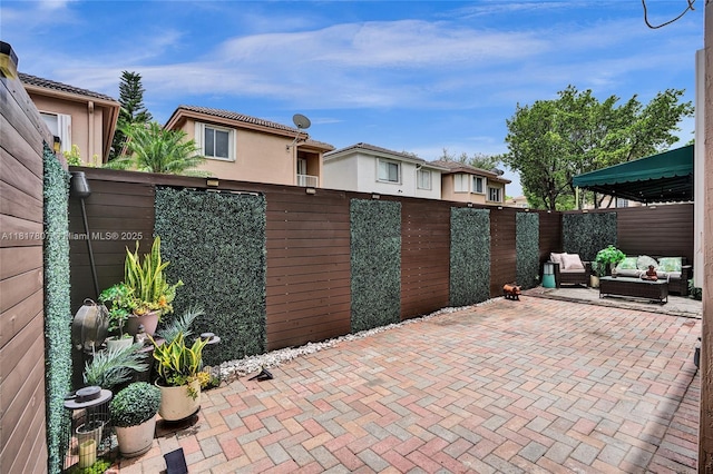 11222 NW 73rd Ter, Doral, FL 33178 - fenced backyard with an outdoor hangout area and a patio