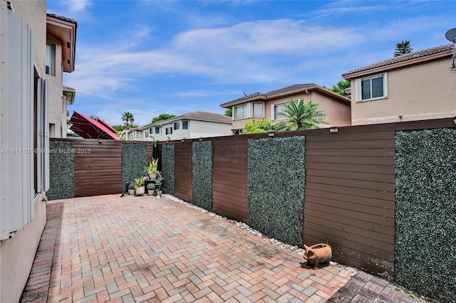 11222 NW 73rd Ter, Doral, FL 33178 - gate with a patio area and a residential view